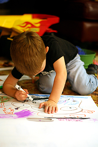 Jackson, the budding mural artist, working on his next masterpiece in his studio